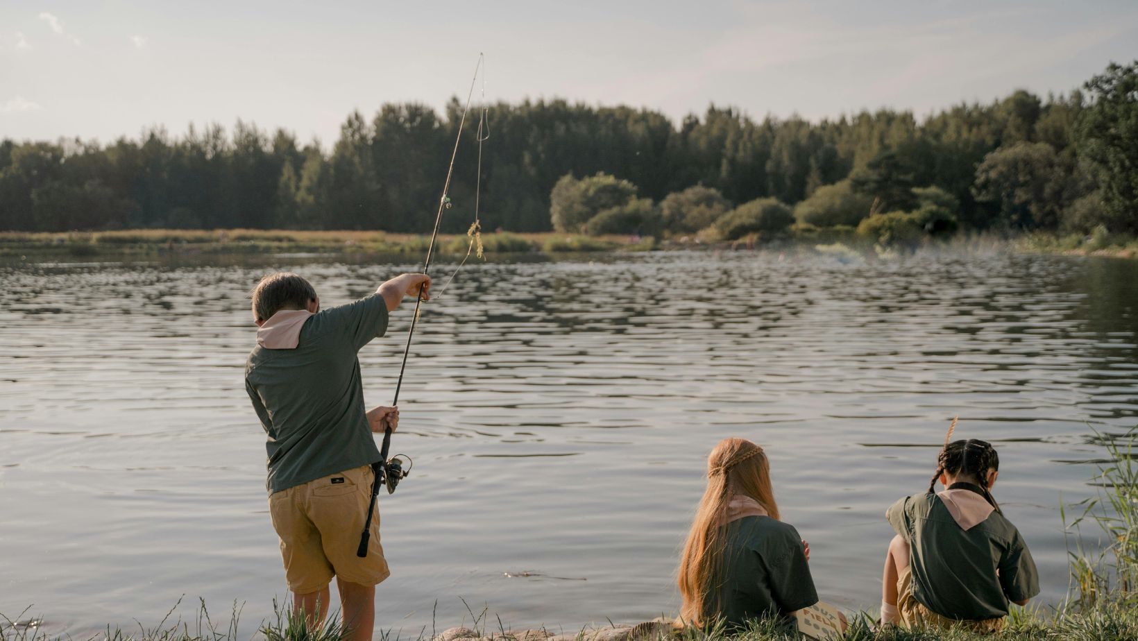 kids fishing at lakeshore